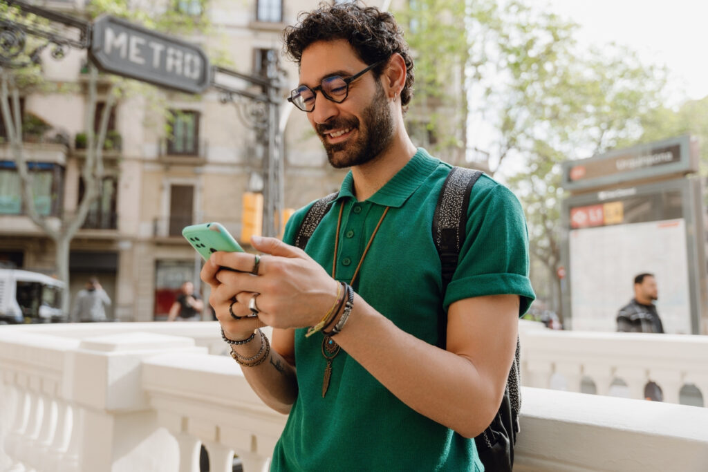 Traveler checking a phone while exploring a European city
