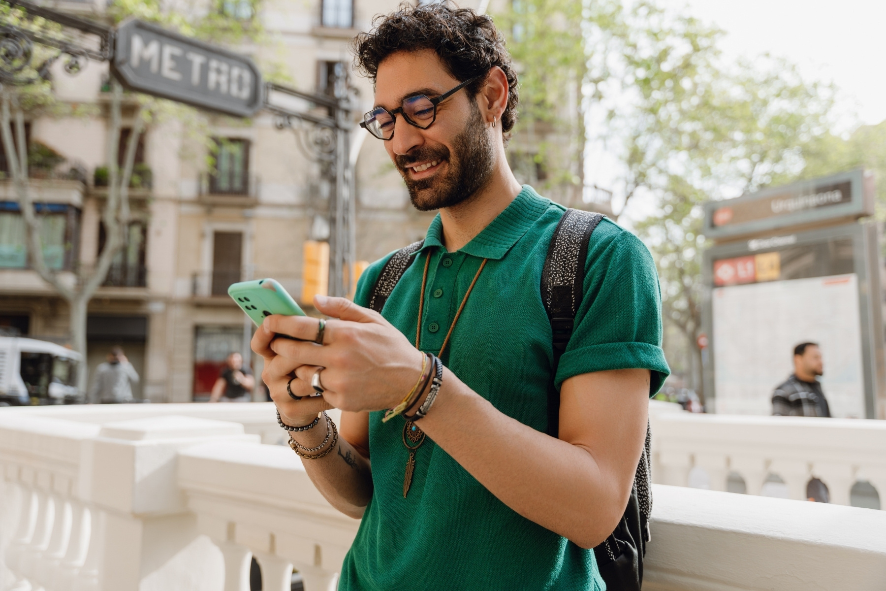 Traveler checking a phone while exploring a European city
