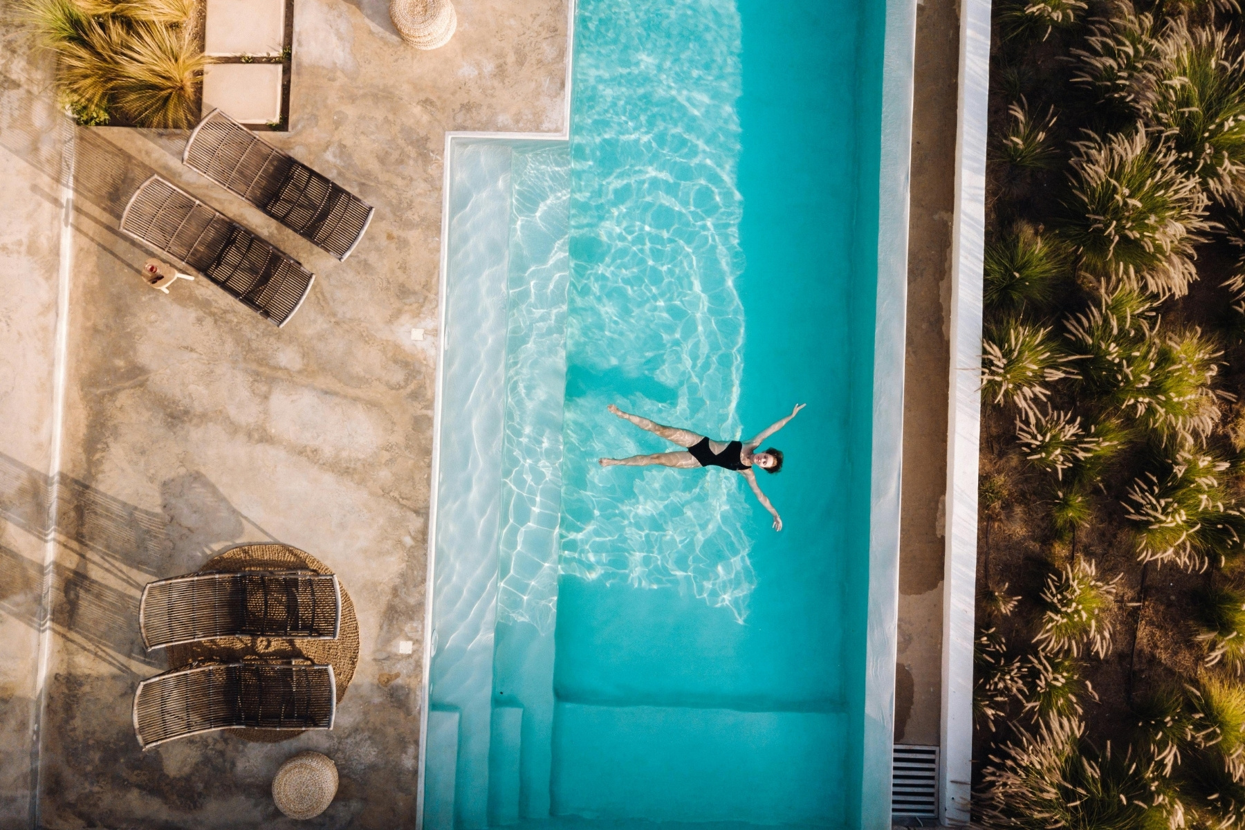 Traveler enjoying a luxury vacation while understanding the importance of travel insurance protection