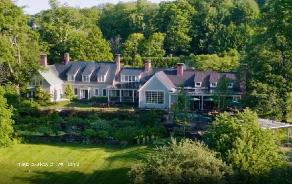 Twin Farms Main House in Barnard, Vermont, surrounded by summer gardens