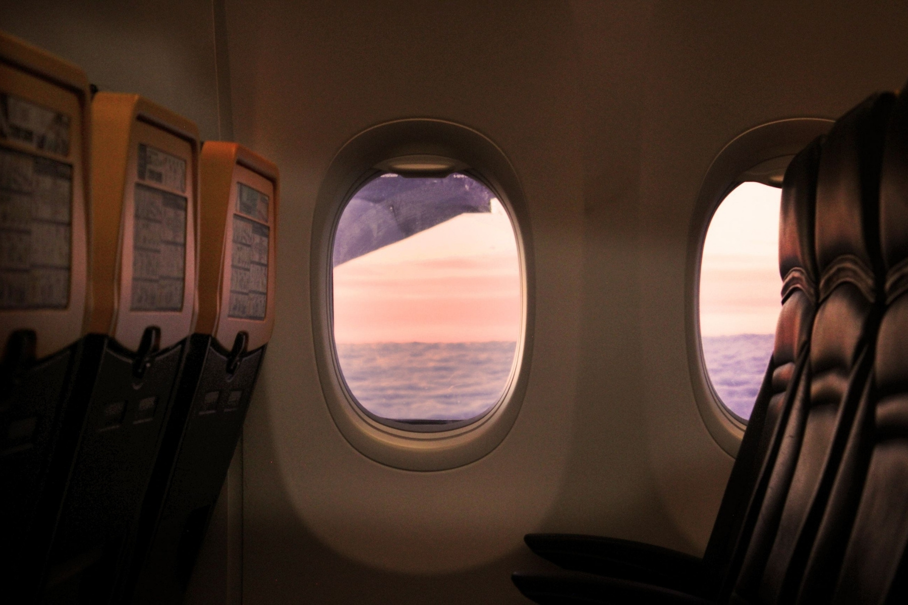 Quiet airplane cabin with window views during a long flight