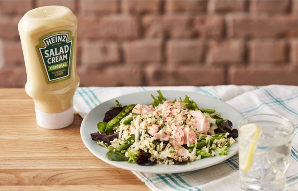 Bottle of Heinz Salad Cream beside a salad